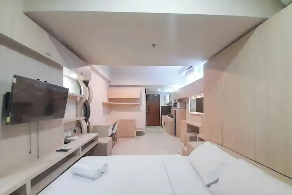 Best Homey and Modern Studio at Uttara The Icon Apartment By Travelio
