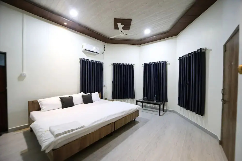 Whispering Palms by StayVista - Pool-view villa with Boutique interiors, Terrace & Lawn