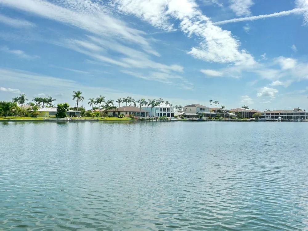 Waterfront home with views, pool and walk to beach
