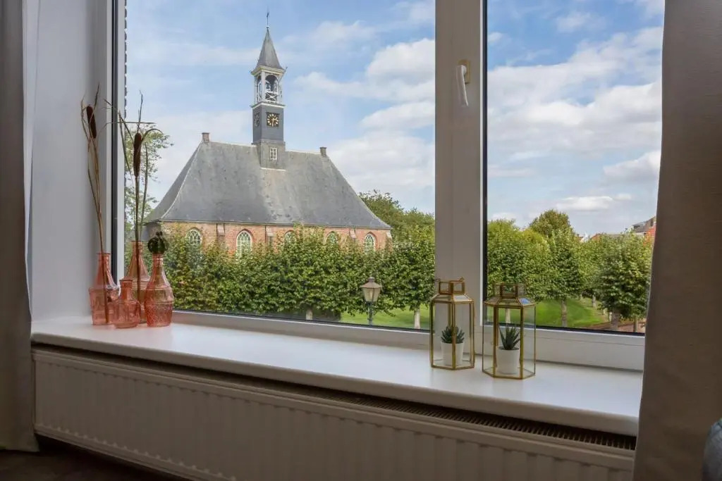 Groepsappartement- Dorpsplein 6 Koudekerke Pleinzicht