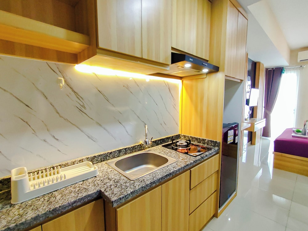 Wood Accents Studio At Grand Dharmahusada Lagoon Apartment