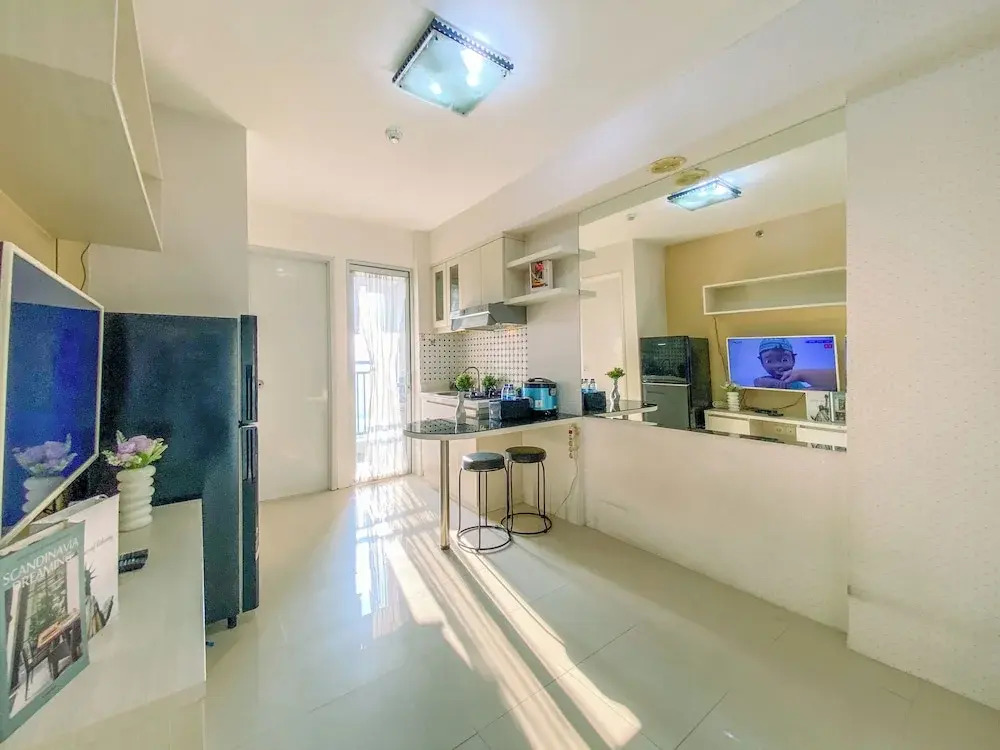 2BR with Cozy Style at Bassura City Apartment By Travelio