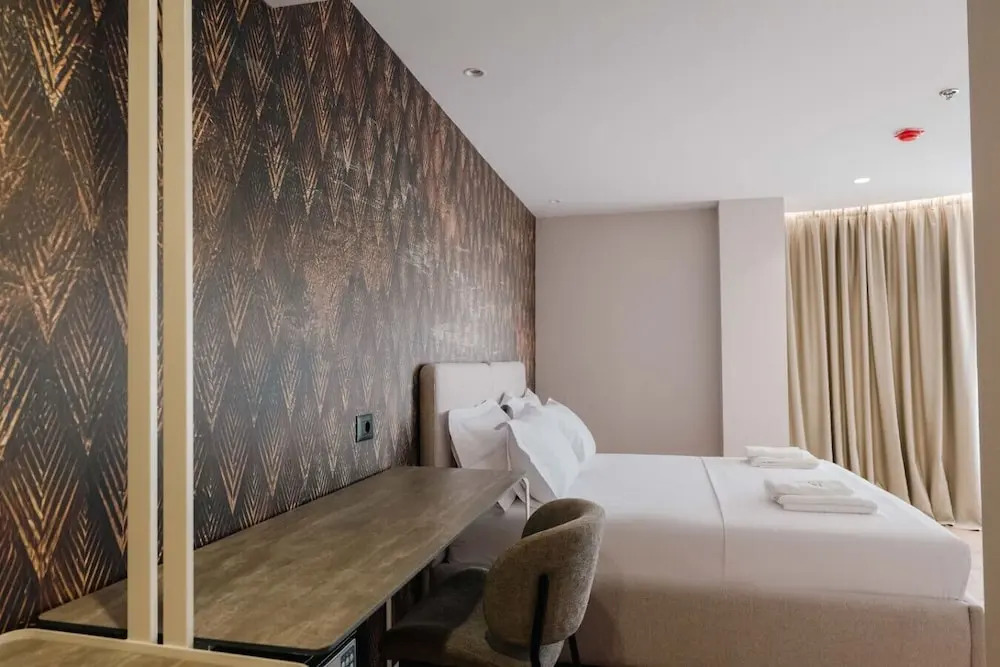 Ermes Deluxe Triple Room