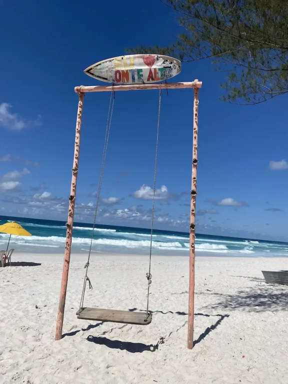 Pé na areia.