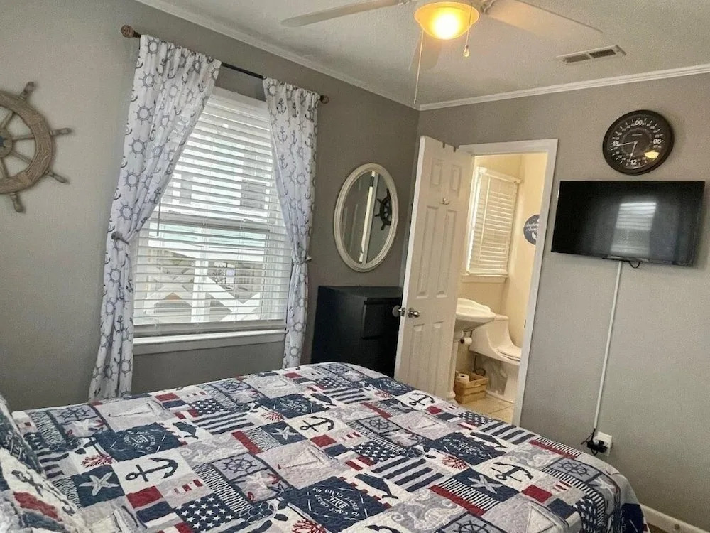 Sandy Bottoms 4 Bedroom Home by RedAwning