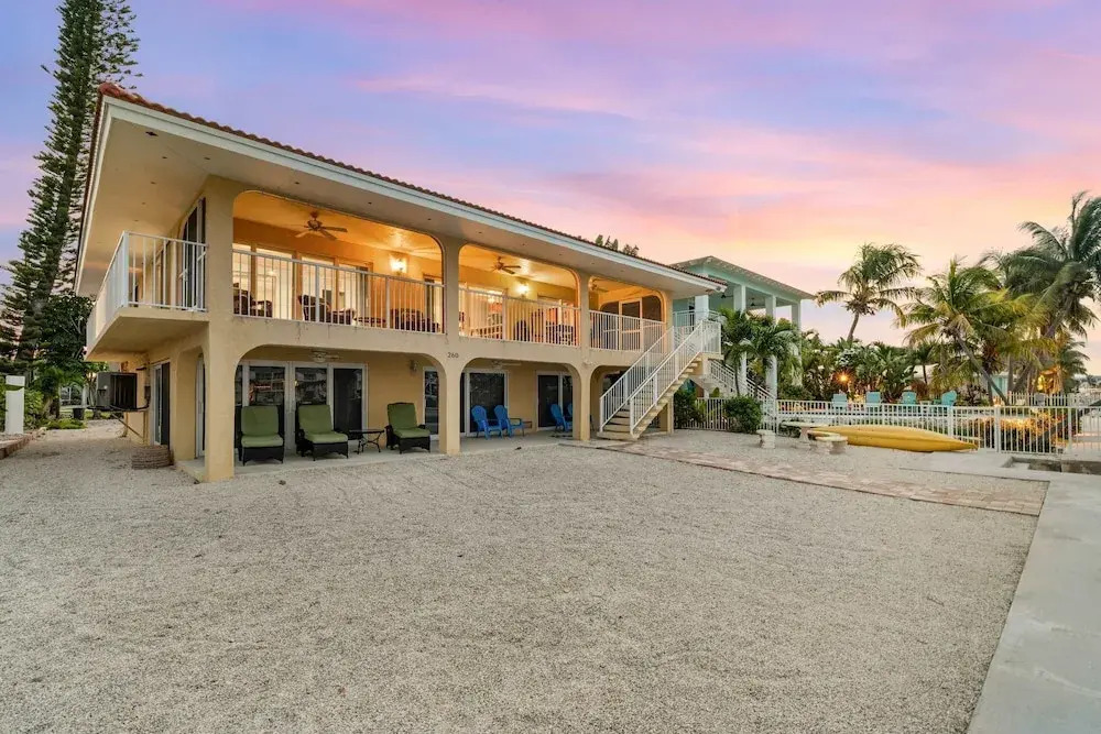 Sunset Harbor Waterfront Villa with Dock Cabana Club