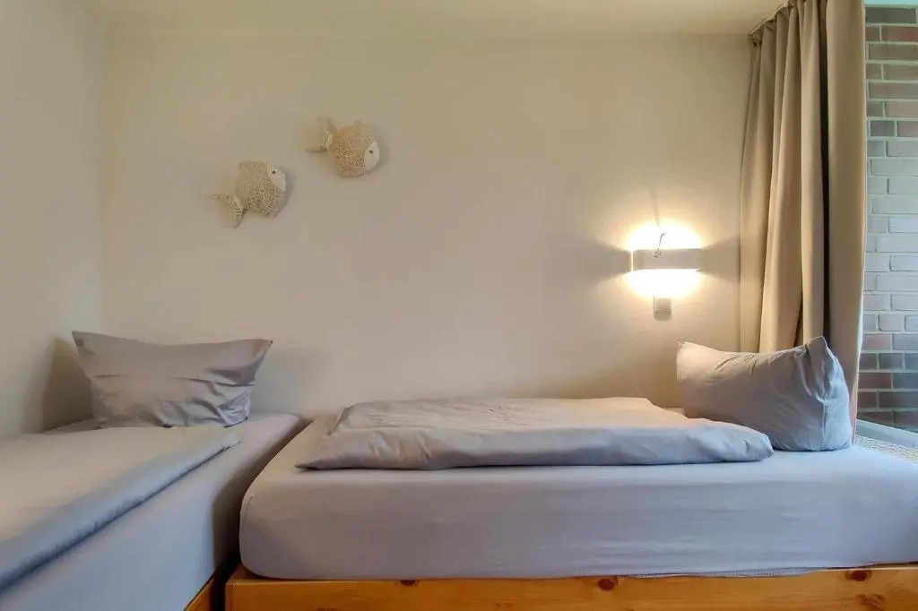 Ferienwohnung-11-mit-Terrasse-und-Strandkorb-am-Strand-Haus-Hohe-Worth-Duhnen