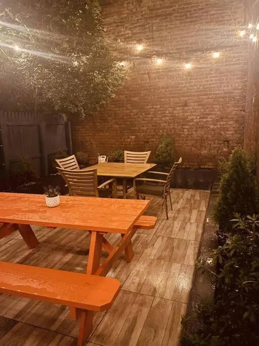 1850s historic Row House 7min train to NYC with private backyard