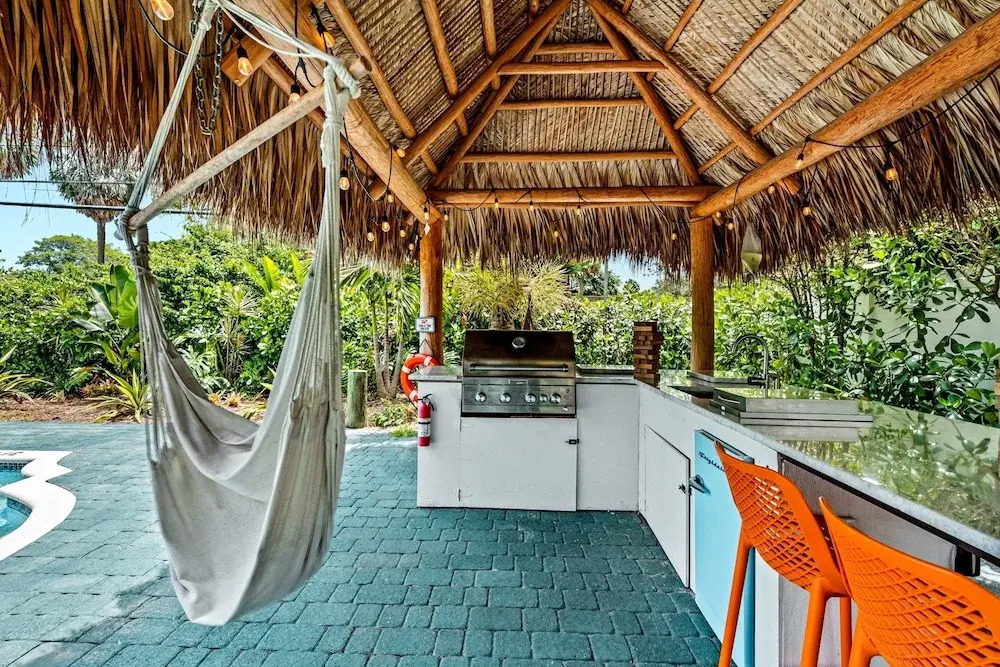 Eccentric Home With Pool Tiki hut Outdoor Kitchen