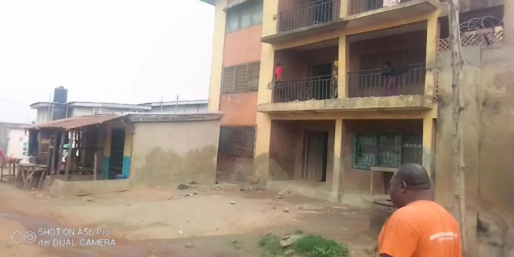 A 2-story building with 2 shops