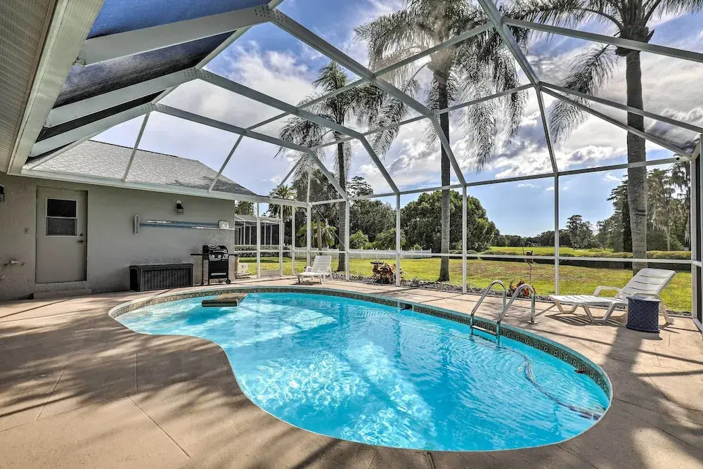 Palm Harbor Home w/ Pool & Golf Course Views!
