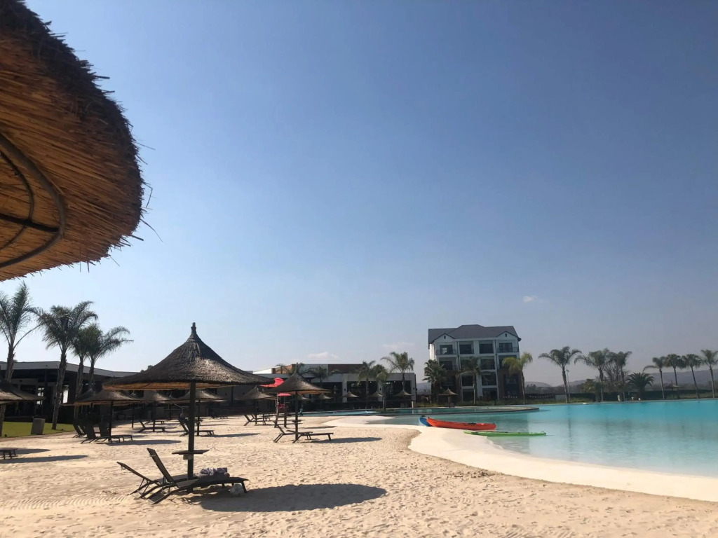A Coastal/island experience at a Large 2 bed apartment at a Crystal Lagoon Estate
