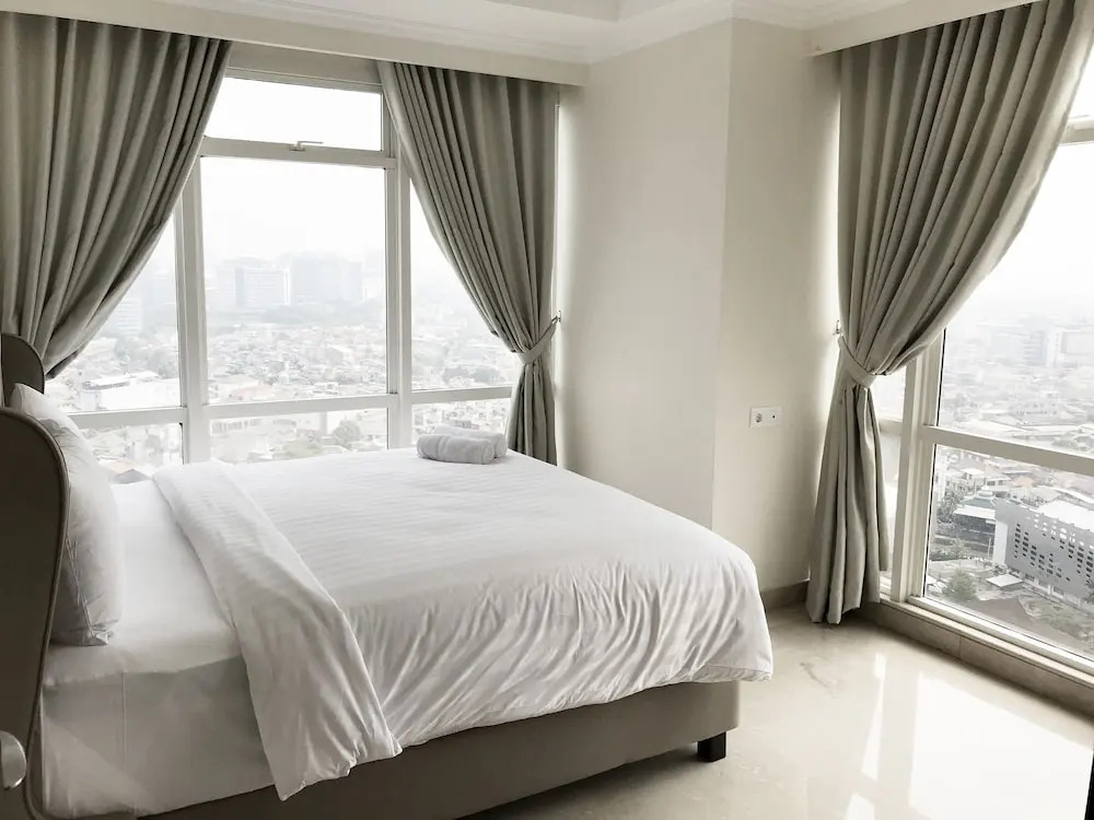 Luminous 2 Bedrooms at Menteng Park Apartment by Travelio