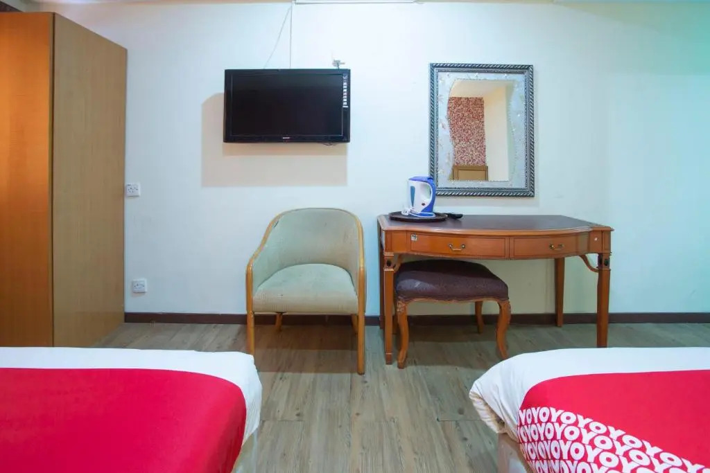 Capital O Hotel Grand Orchard