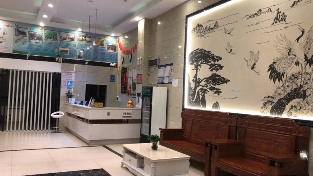 Q+ Nanxiong Xinhewan Business Hotel