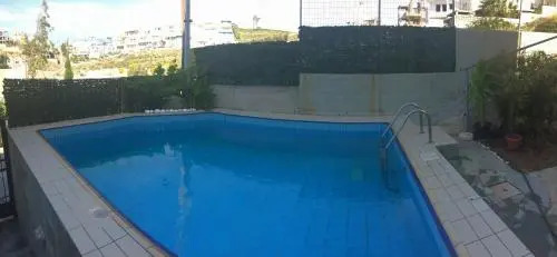 Family Apartment Ammoudi with shared mini-pool