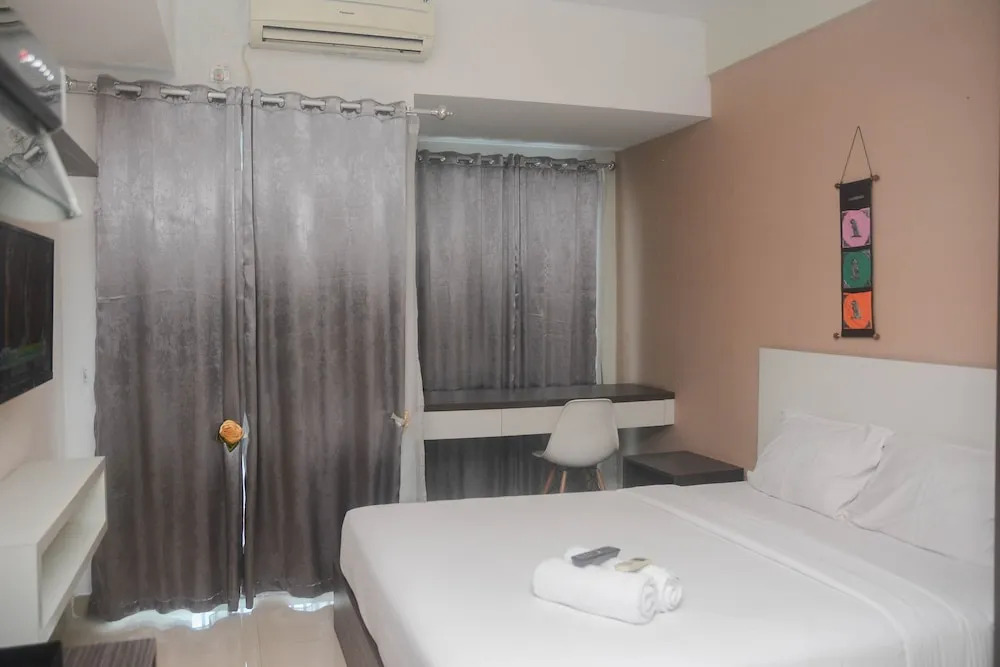 Minimalist and Comfy Studio at Grand Dhika City Apartment By Travelio