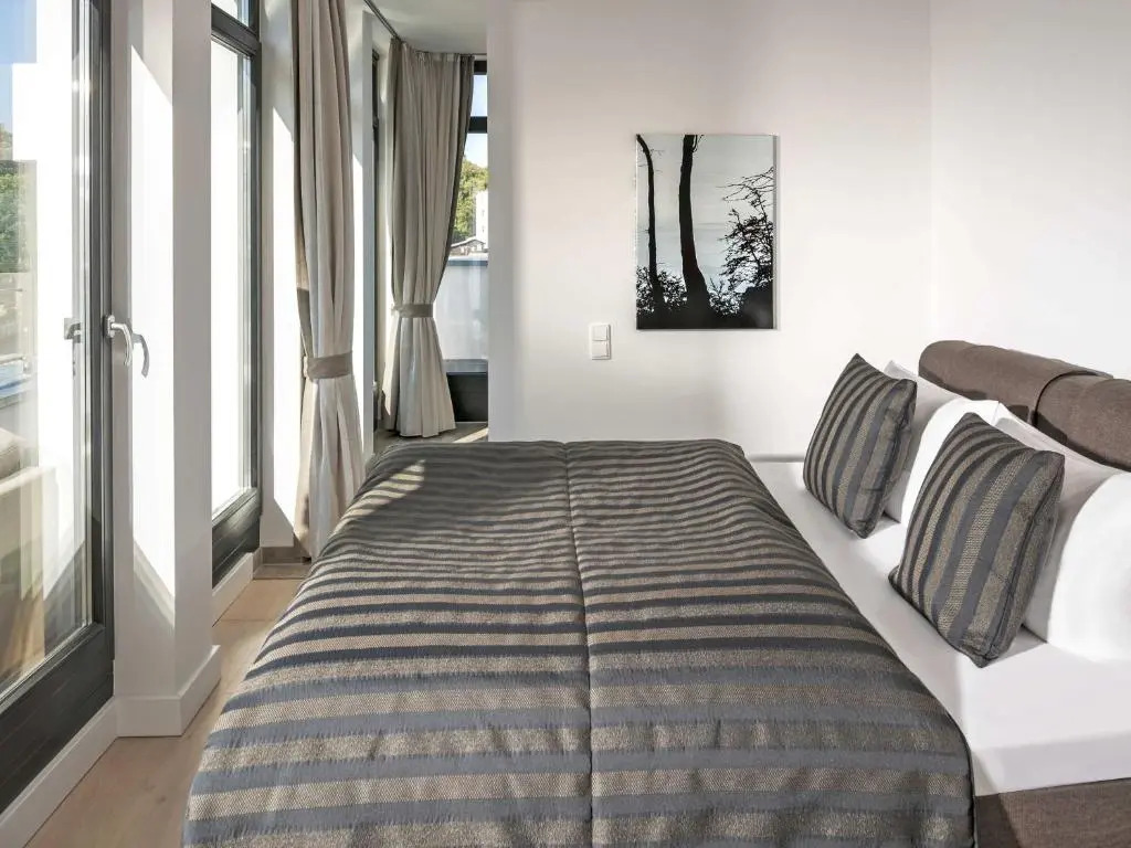Villa Philine - Penthouse 28 mit Panoramablick, Pool, SPA & Kamin