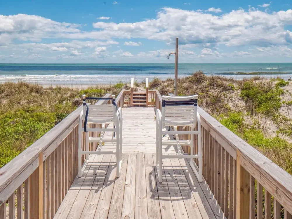 A Charm of Finches by Topsail Realty