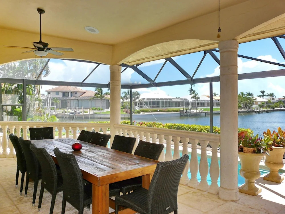 Serene waterfront home with pool, spa, and water view