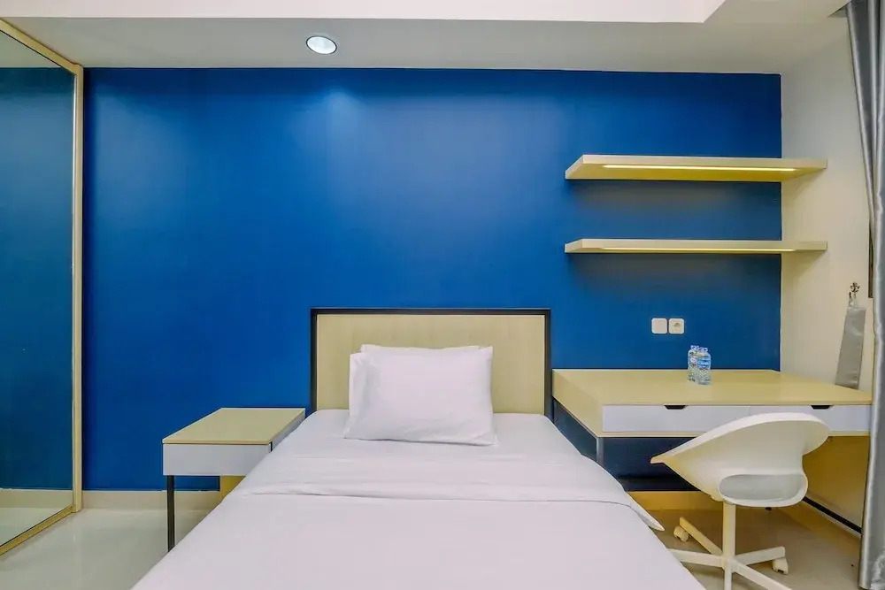 Comfy and Minimalist Studio with City View at Evenciio Margonda Apartment
