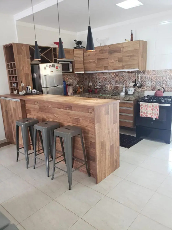 Casa com piscina e churrasqueira em Massaguaçu SP