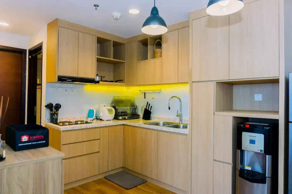 Spacious 1BR with Japandi Design at West Vista Apartment By Travelio