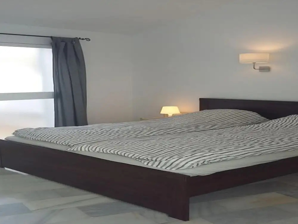 Sunny and spacious apartment with own entrance to pool