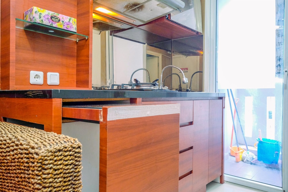Comfy and Great Choice 2BR Green Pramuka City Apartment By Travelio