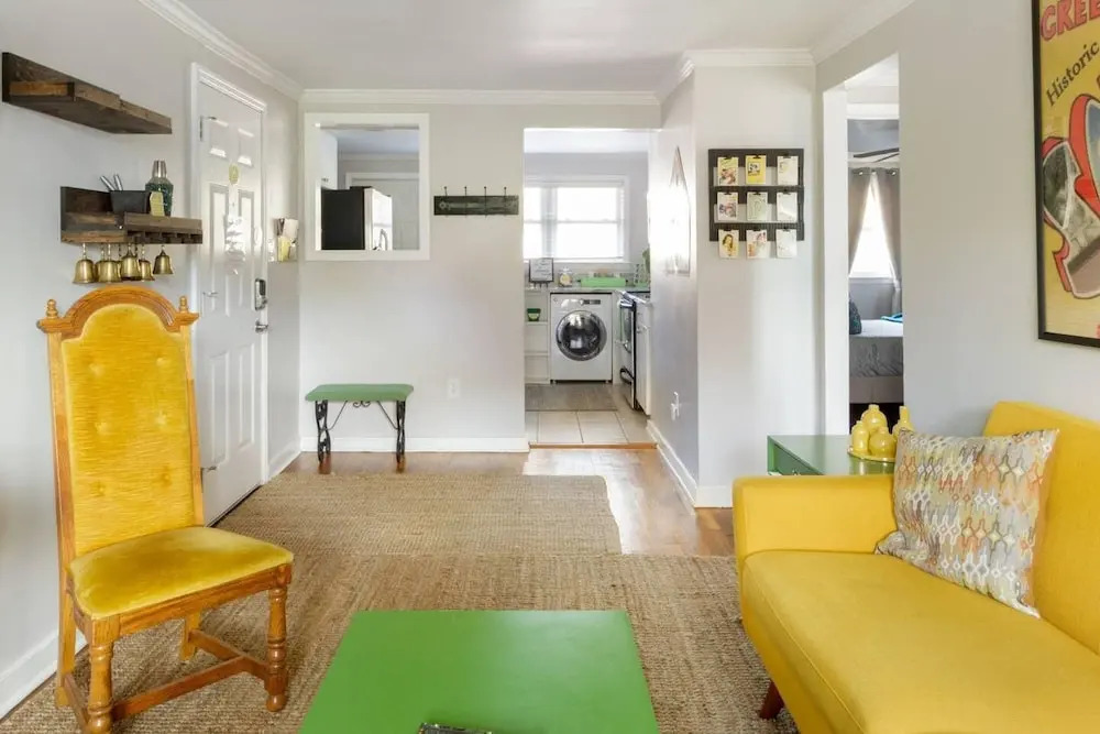 Vibrant, Colorful Condo Building With Backyard Firepit and Games