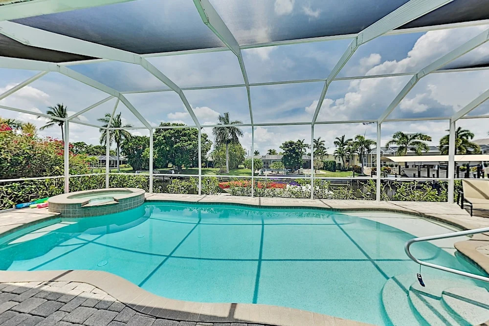 Upscale All-suite Canal W/ Dock & Fireplace 4 Bedroom Home