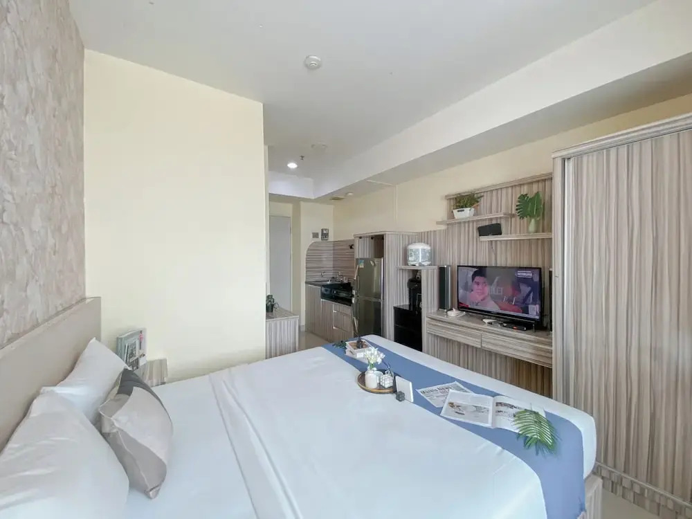 Modern and Homey 1BR without Living Room at Grand Kamala Lagoon Apartment By Travelio