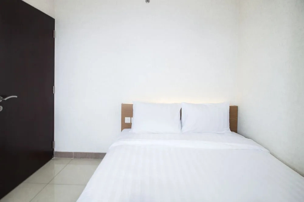 2BR Cozy at Empyreal Epicentrum Apartment By Travelio