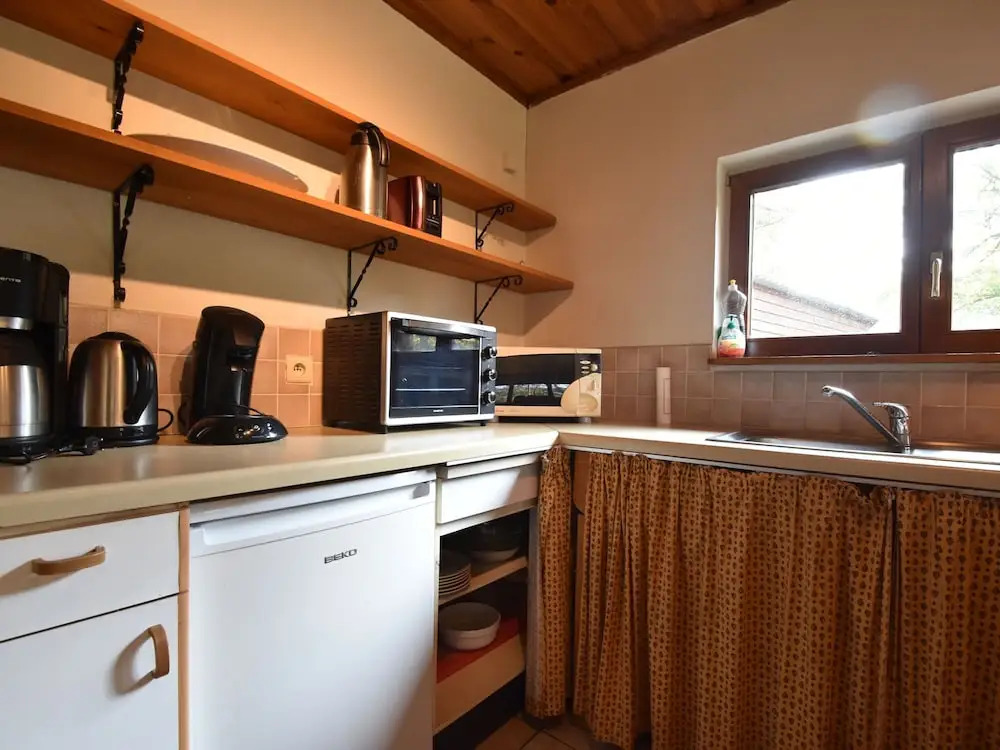 Nestled In A Green Scenery, This Chalet Along The River Is Perfect To Chill Out!