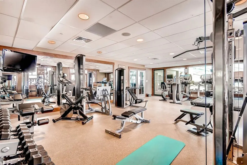 Expansive 4 Bedroom Ski in, Ski out One Ski Hill Residence Located at the Base of Peak 8 with Beautiful Views