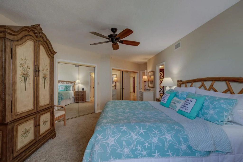 Stunning ground floor condo with lush lawn overlooking white sands