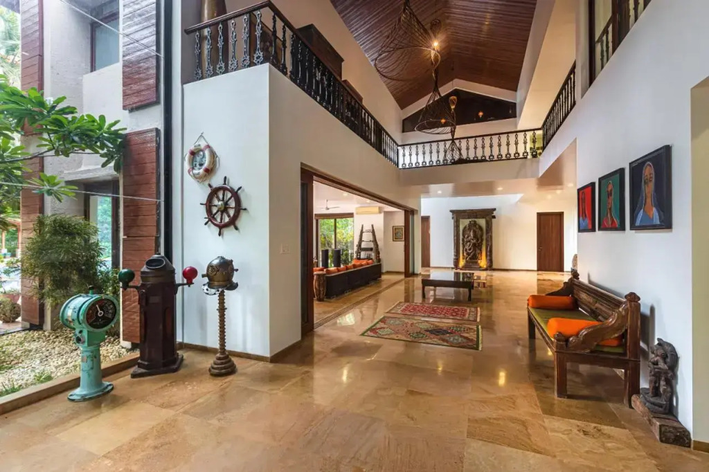 SaffronStays Casa Del Palms - 8BR luxury pool villa with gazebo, pickleball, bar & lawns near Nagaon Beach