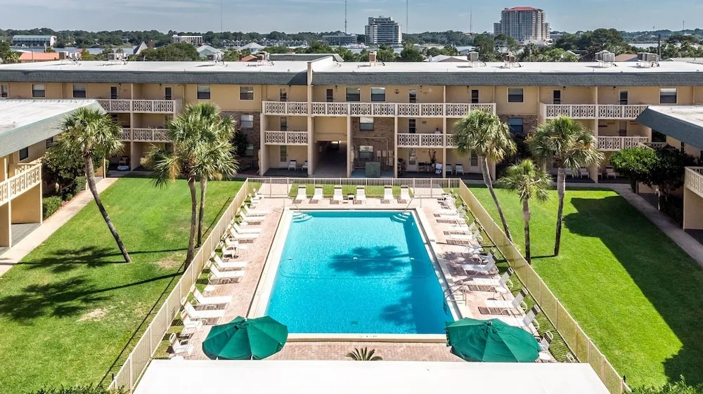 Ground Floor Pool Front Condo Sleeps 8 with easy beach access by RedAwning