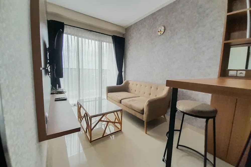 Elegant and Spacious 1BR at Patraland Amarta Apartment By Travelio