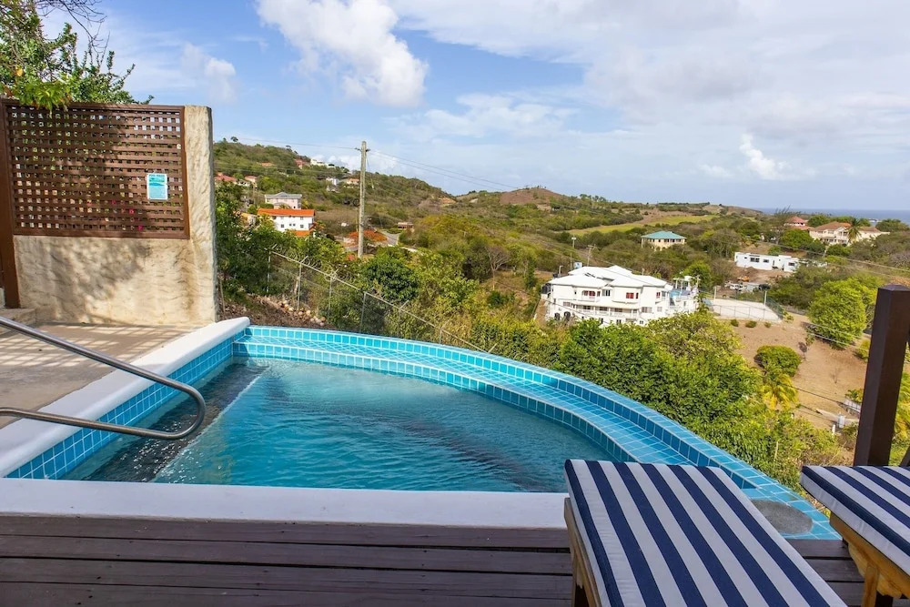 Charming Cottage Located In Cap Estate - Orchid Cottage 1 Bedroom Home by RedAwning