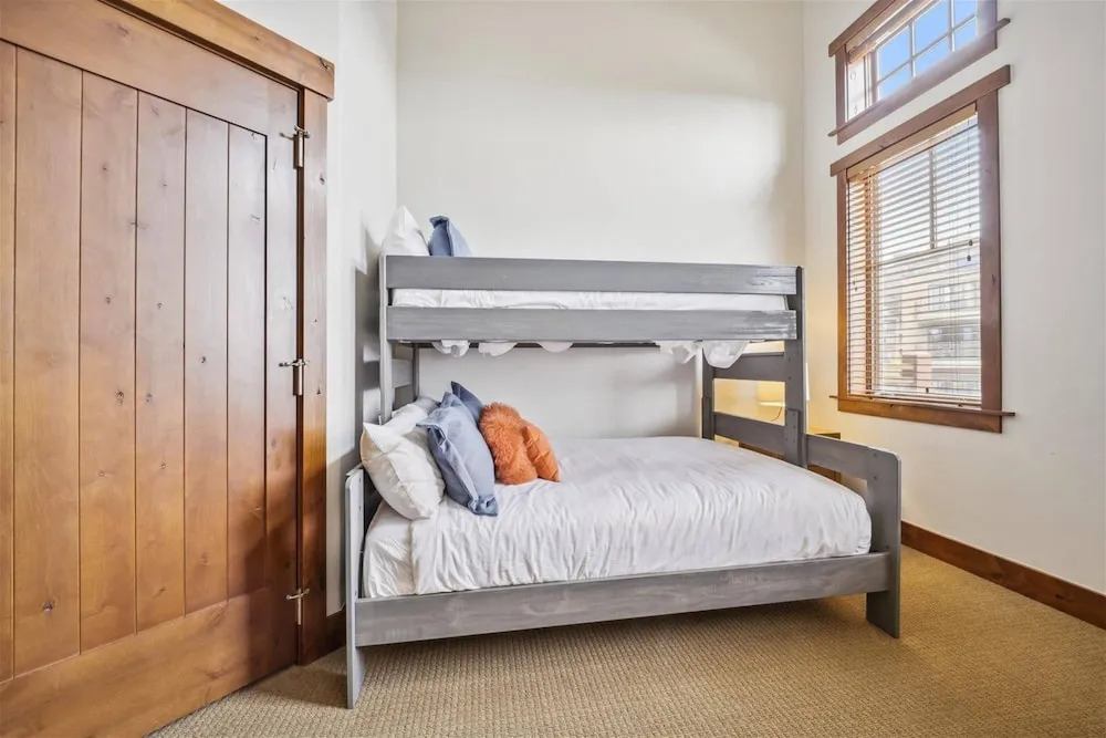 Expansive 4 Bedroom Ski in, Ski out One Ski Hill Residence Located at the Base of Peak 8 with Beautiful Views