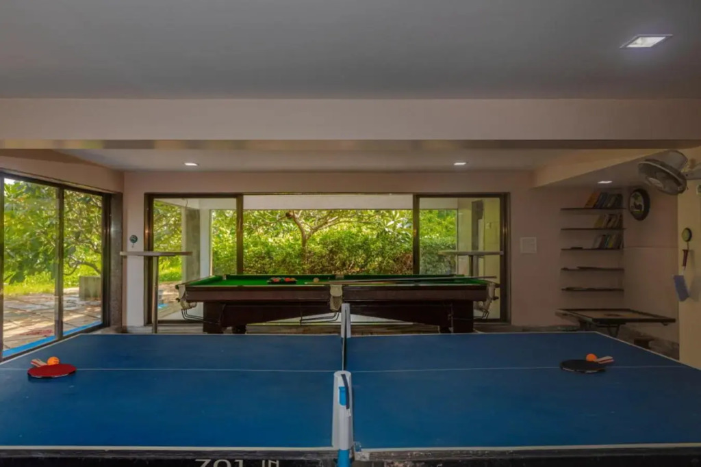 SaffronStays Aura, 4 BR Luxury Pool Villa with Game Room & Lawn