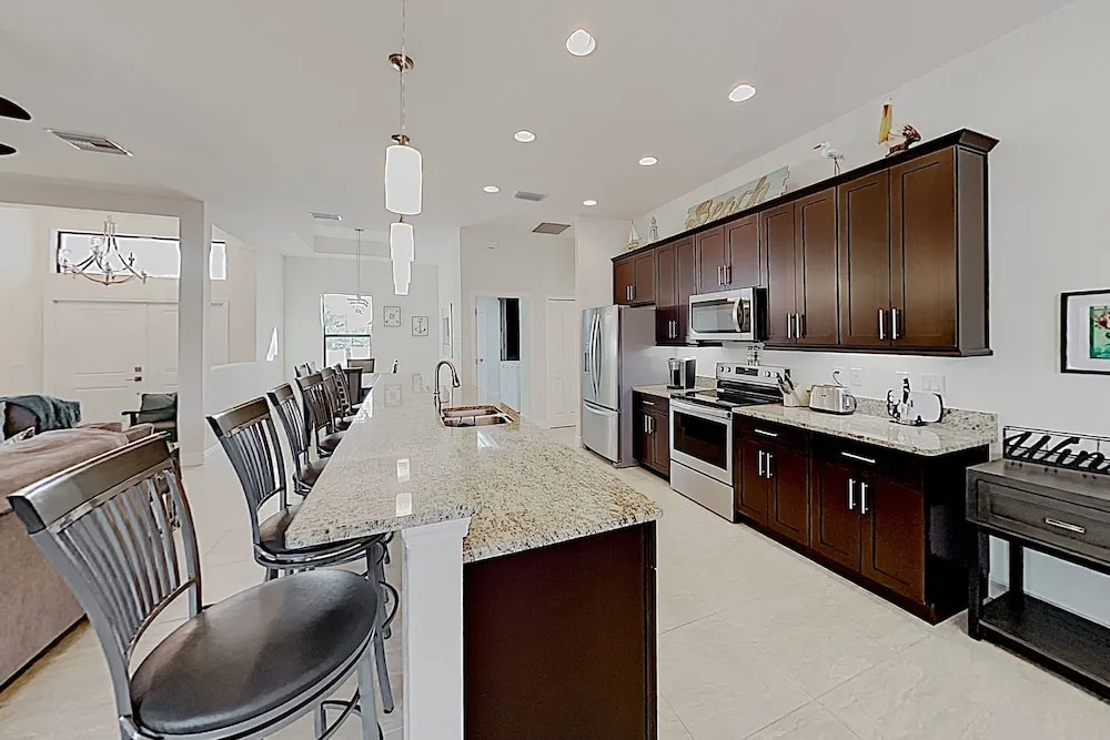 Impeccable Canal-front W/ Lanai & Caged Pool 4 Bedroom Home