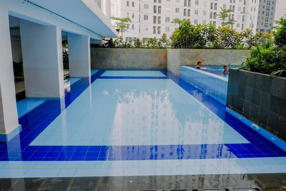 2BR Minimalist Bassura City Apartment By Travelio