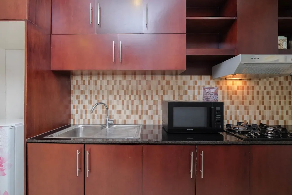Luxury and Strategic 1BR Apartment at The Empyreal Epicentrum By Travelio