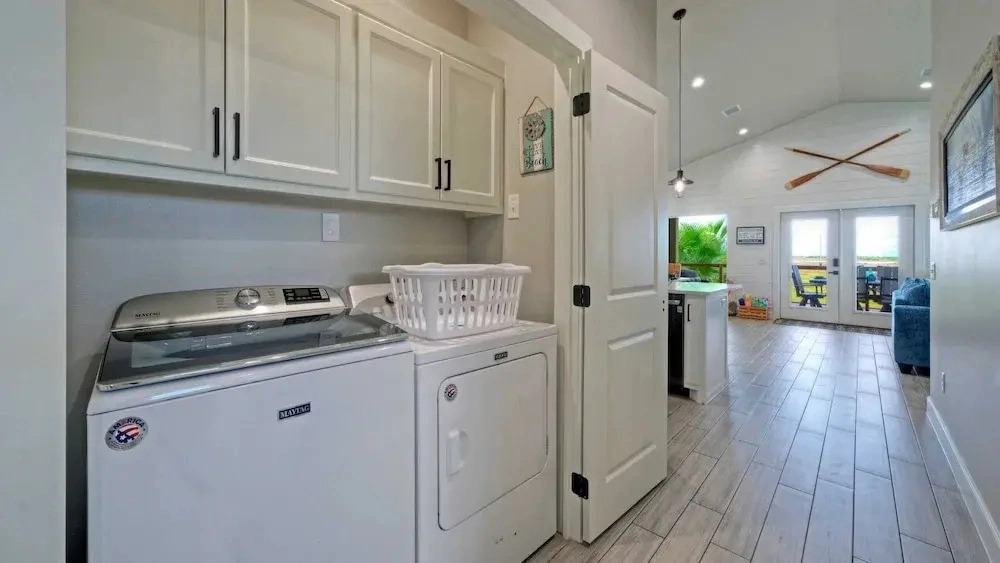 Bayfront Home w/ Pool, Game Room + Walk to Beach & Golf Cart Access Pelicans Perch by Avantstay