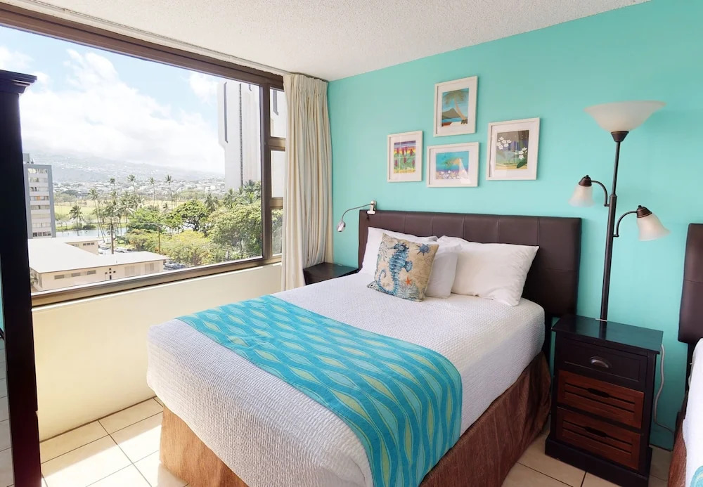 Waikiki Banyan High Level Condo with Ocean Views from the Private Lanai