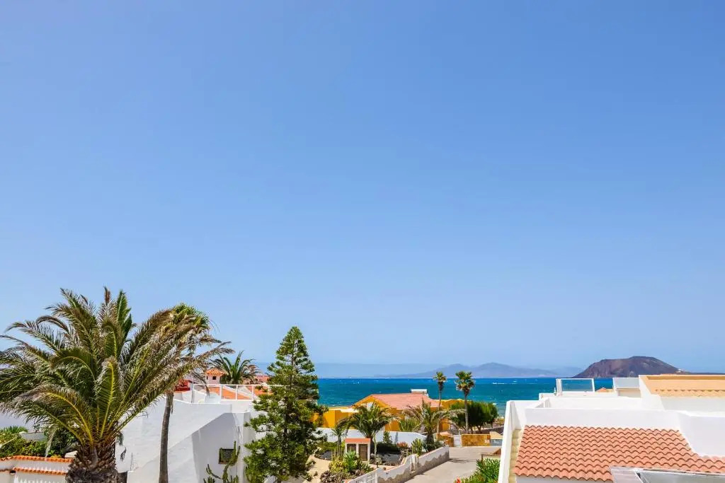Bohemian Seafront Bungalow Paradise with BBQ, Garden, Terrace & Free Wifi by Holidays Home