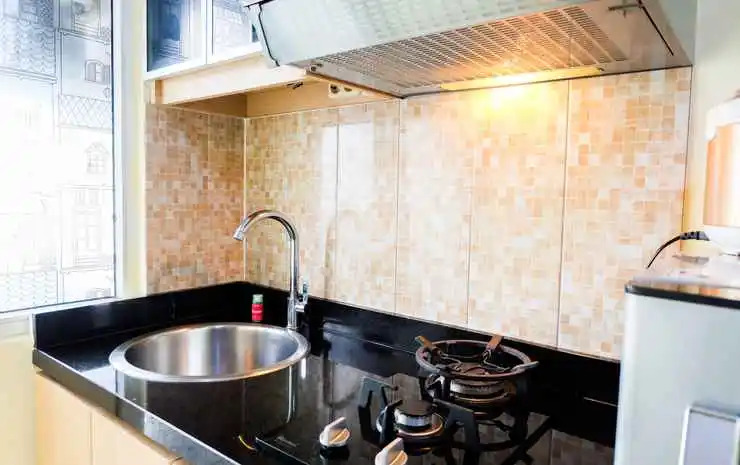Compact and Cozy Studio Apartment Green Pramuka City By Travelio