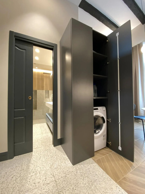 Apartment suitable for families or couples, equipped kitchen and laundry corner, private balcony-Mattia by Dimore Garibaldi